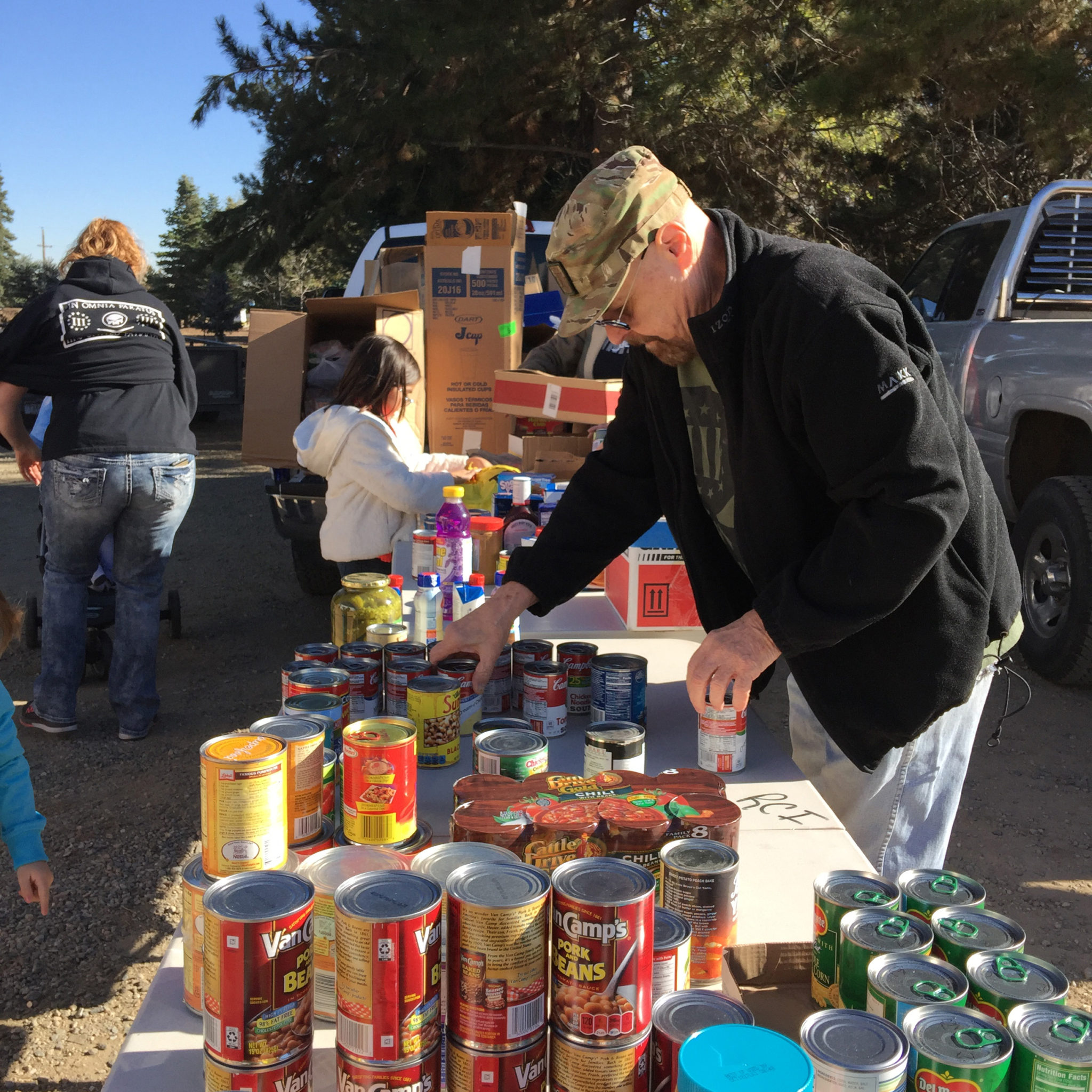 Volunteer stacking canned goods